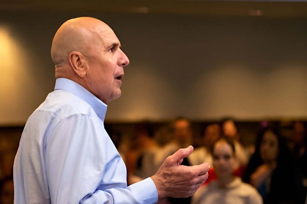 real estate investing expert speaking in front of an audience