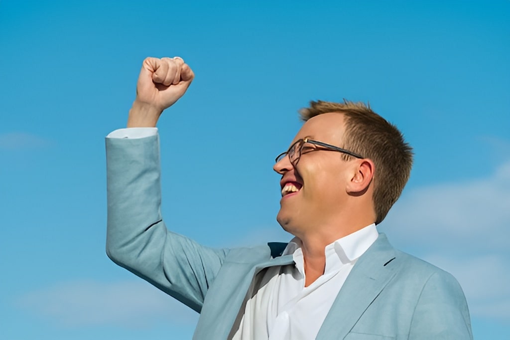 real estate investor celebrating financial freedom