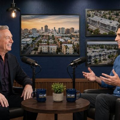 Lou Brown and Jon Swire discussing multifamily real estate investing strategies in a professional podcast studio